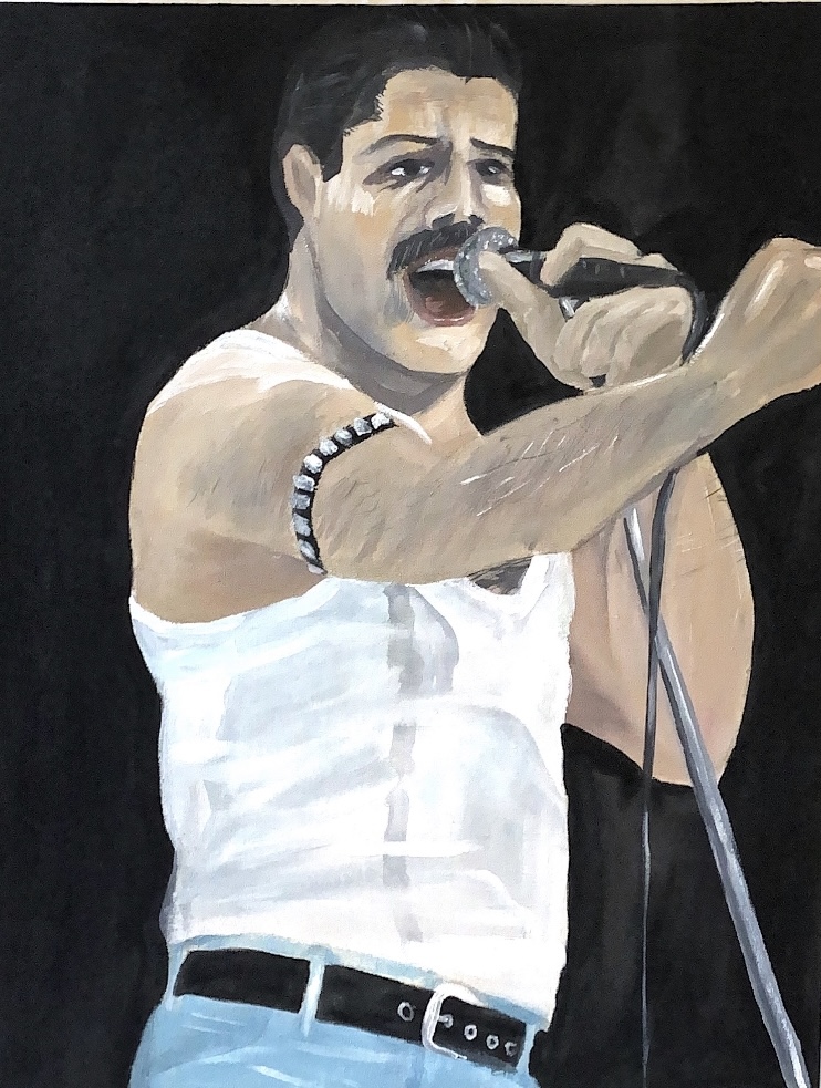 Freddie Mercury singing on stage