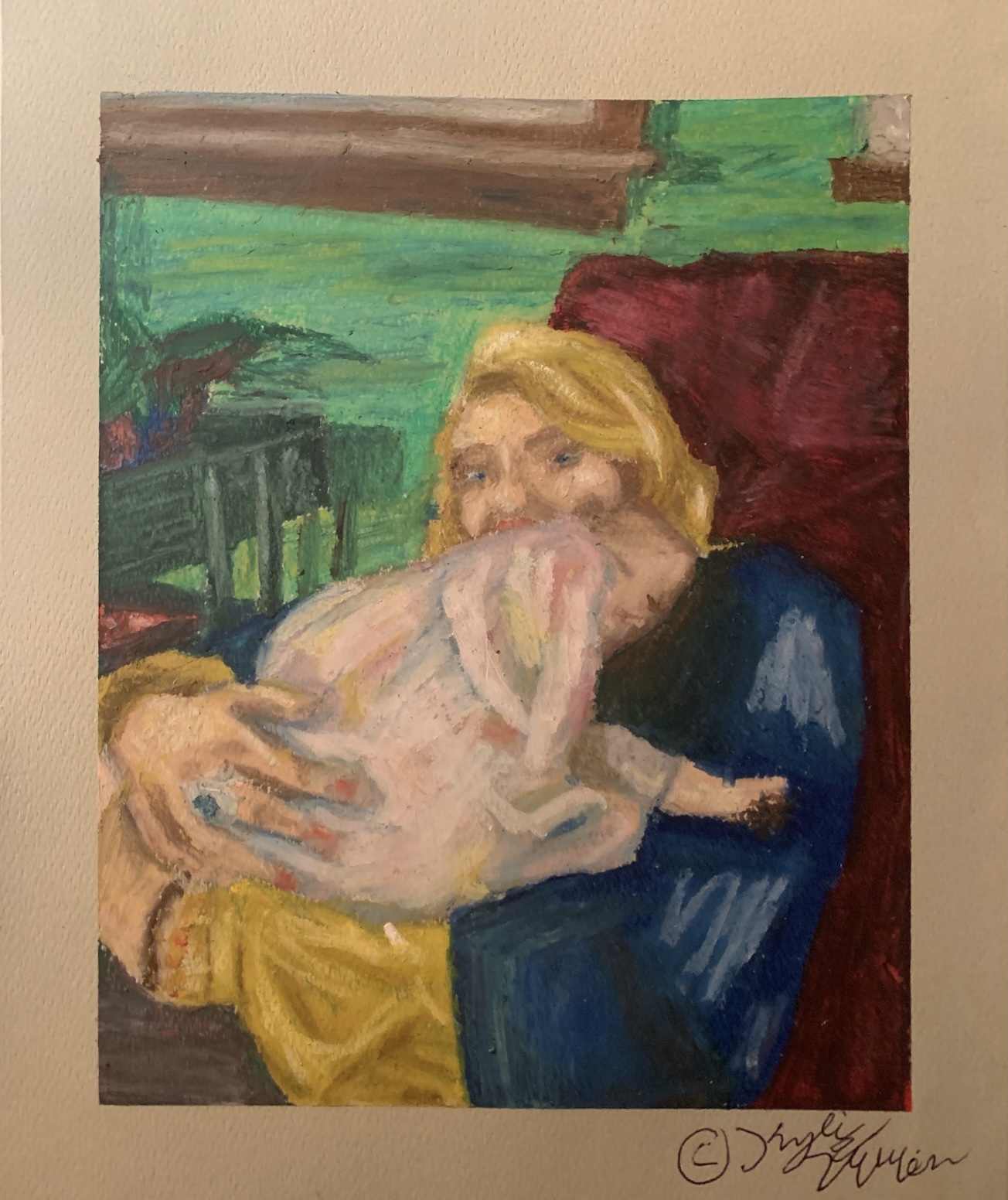 A woman holding a baby while sitting in a chair