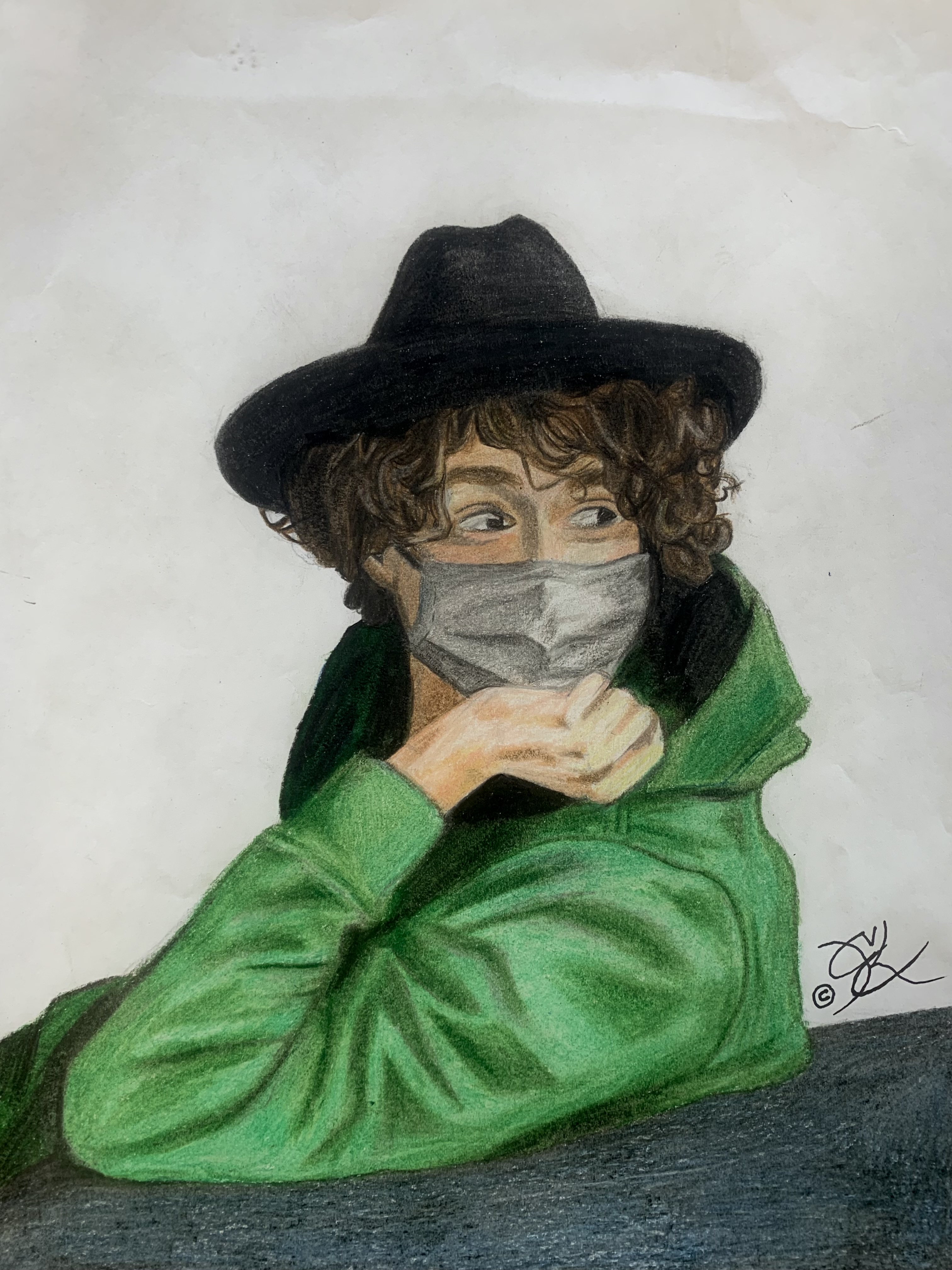 A masked(covid) man looking in the distance